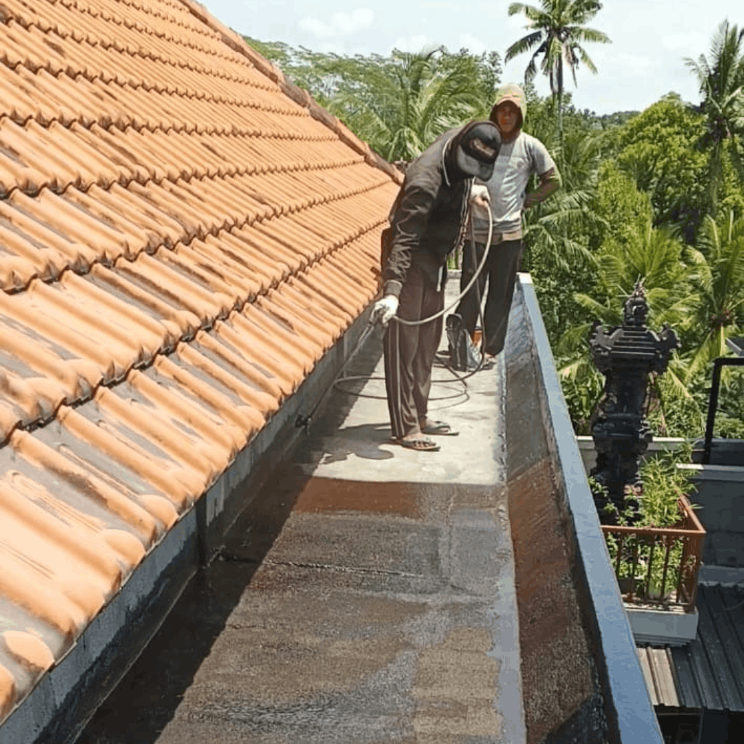 Proses pelapisan aspal cair lapis kedua menyilang